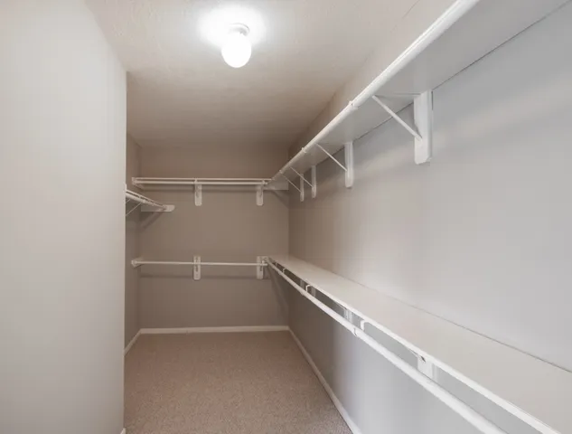 a view of an empty walk in closet