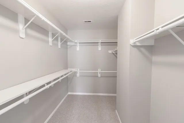 a view of an empty walk in closet
