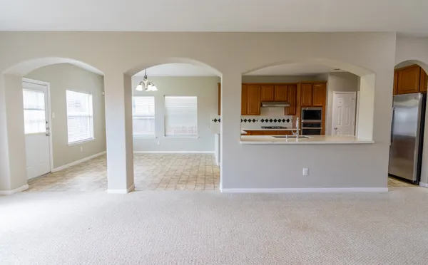 an empty room view with wooden floor and a fireplace