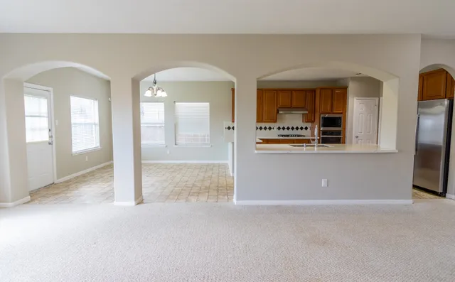 an empty room view with wooden floor and a fireplace