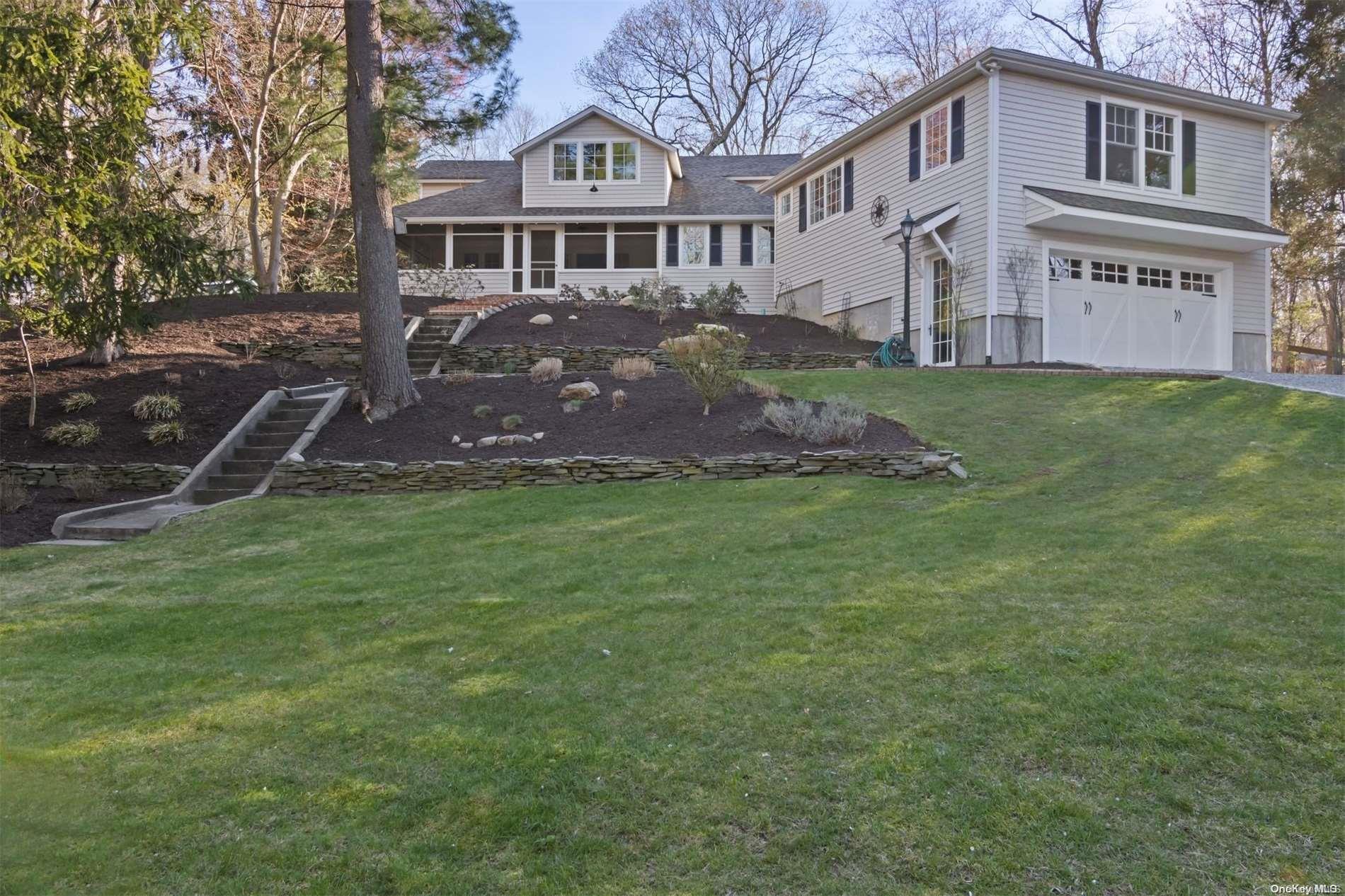 12 Beatty Road Shoreham, NY 11786 - Photo 1 of 1 a front view of a house with a garden