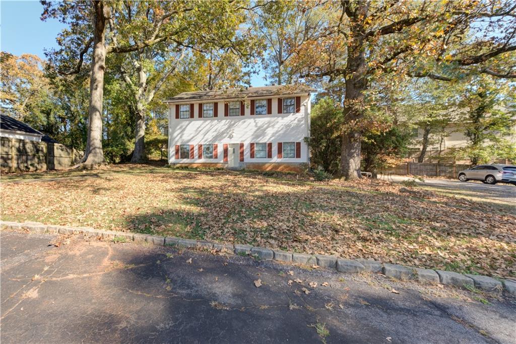 3583 Midway Road Decatur, GA 30032 - Photo 1 of 1 a front view of a house with a yard