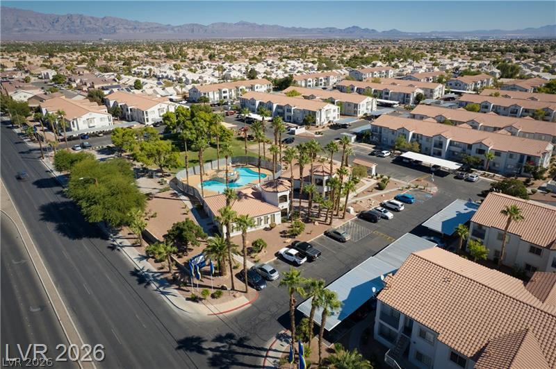 3318 North Decatur Boulevard, Unit 2152 Las Vegas, NV 89130 - Photo 58 of 58 An aerial perspective showcases a vibrant community with resort-style amenities, lush landscaping, and ample parking.