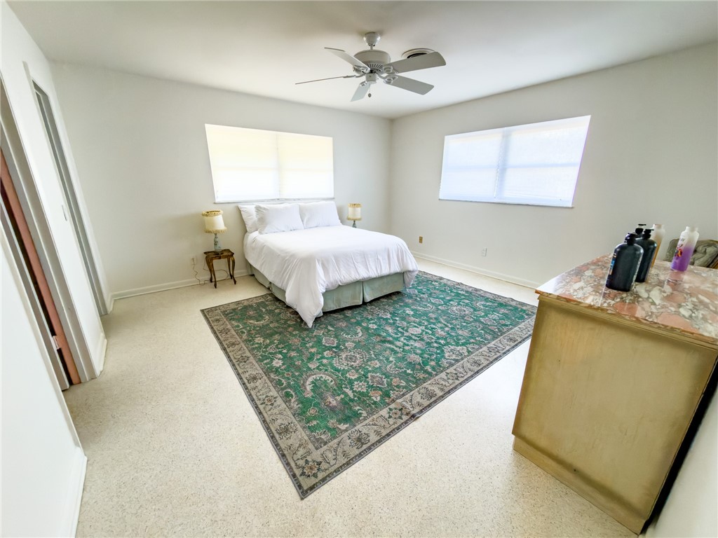 846 Date Palm Road Vero Beach, FL 32963 - Photo 15 of 29 a bedroom with a bed and window