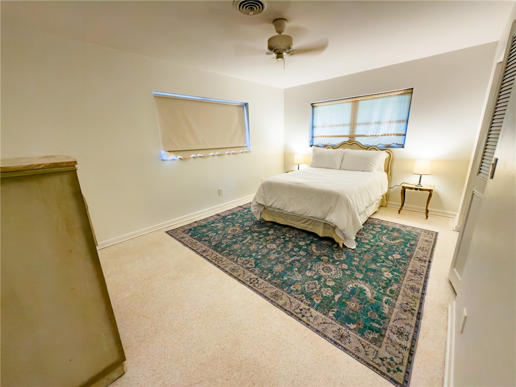 846 Date Palm Road Vero Beach, FL 32963 - Photo 17 of 29 a bedroom with a bed and a window