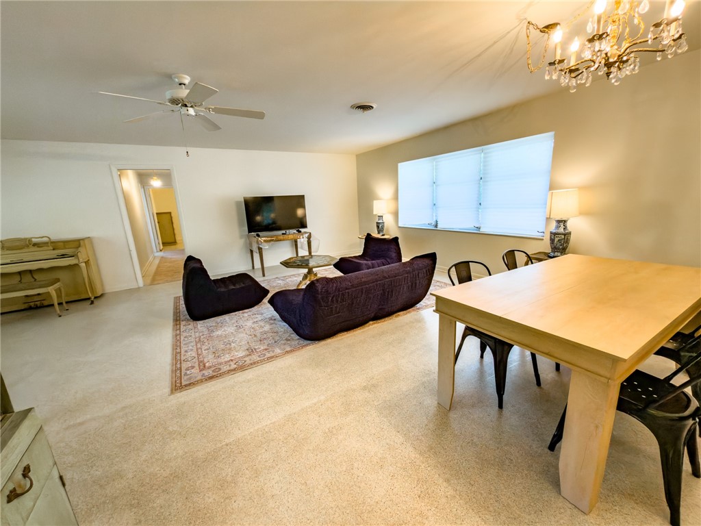 846 Date Palm Road Vero Beach, FL 32963 - Photo 8 of 29 a living room with furniture and a flat screen tv