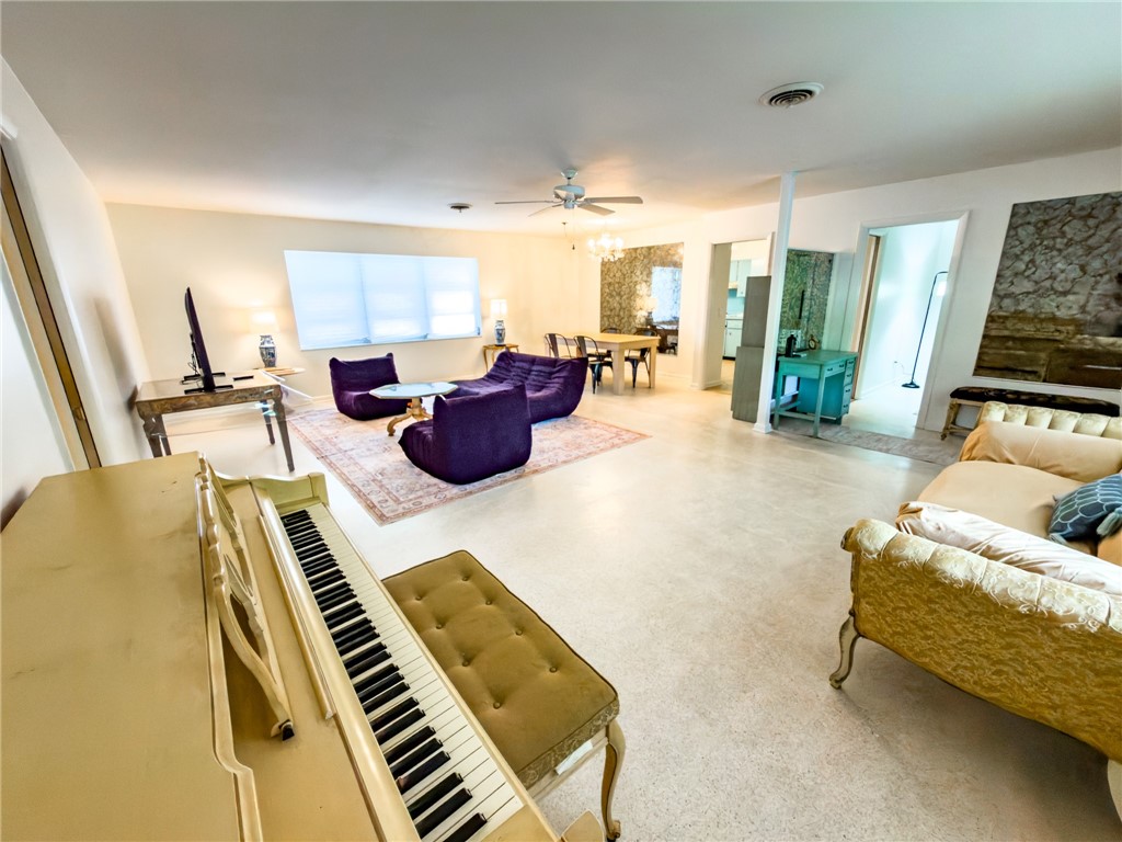 846 Date Palm Road Vero Beach, FL 32963 - Photo 9 of 29 a living room with furniture and a piano
