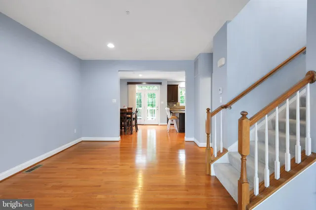 a view of an entryway with wooden floor