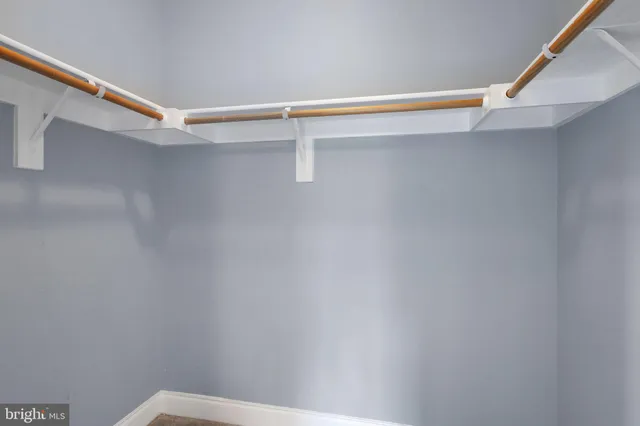 a view of an empty walk in closet