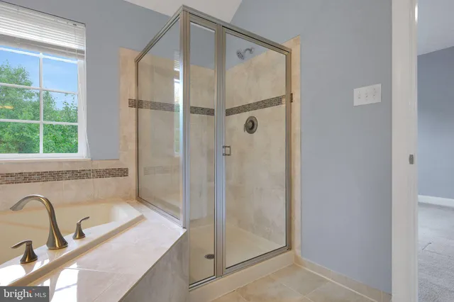 a bathroom with a sink and a shower