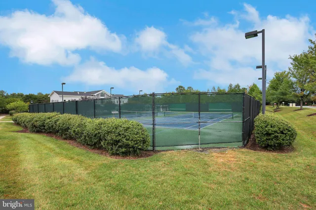 a view of a playground with basketball court