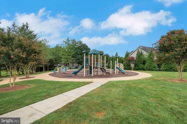 a view of a garden with an outdoor seating