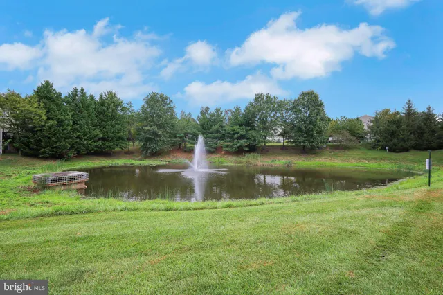 a couple of cars parked in front of a building