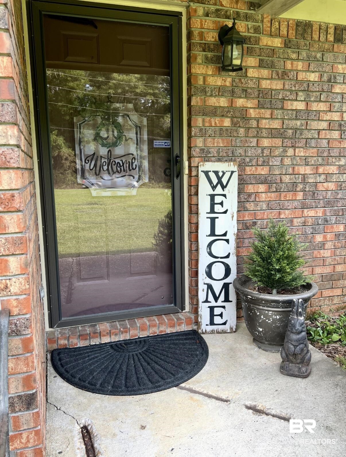 5971 Appleton Road Brewton, AL 36426 - Photo 2 of 23 Doorway to property featuring brick siding