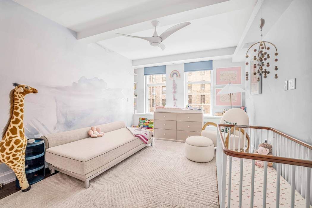 470 West 24th Street, Unit 7GJ Manhattan, NY 10011 - Photo 5 of 11 a bedroom with a bed and a window