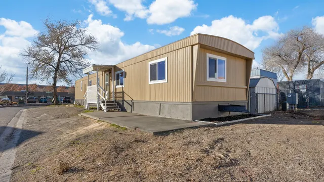 a view of a house with snow on the road