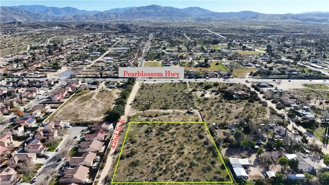 an aerial view of residential houses and city view