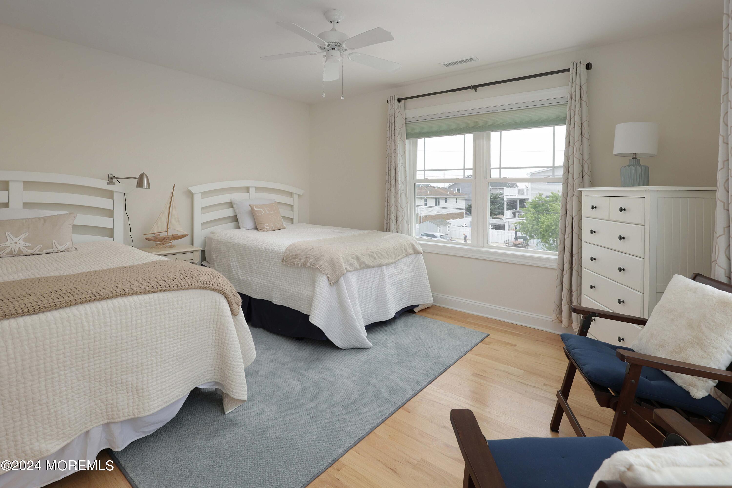 1607 Baltimore Avenue Lavallette, NJ 08735 - Photo 15 of 28 a bedroom with two beds and a dresser