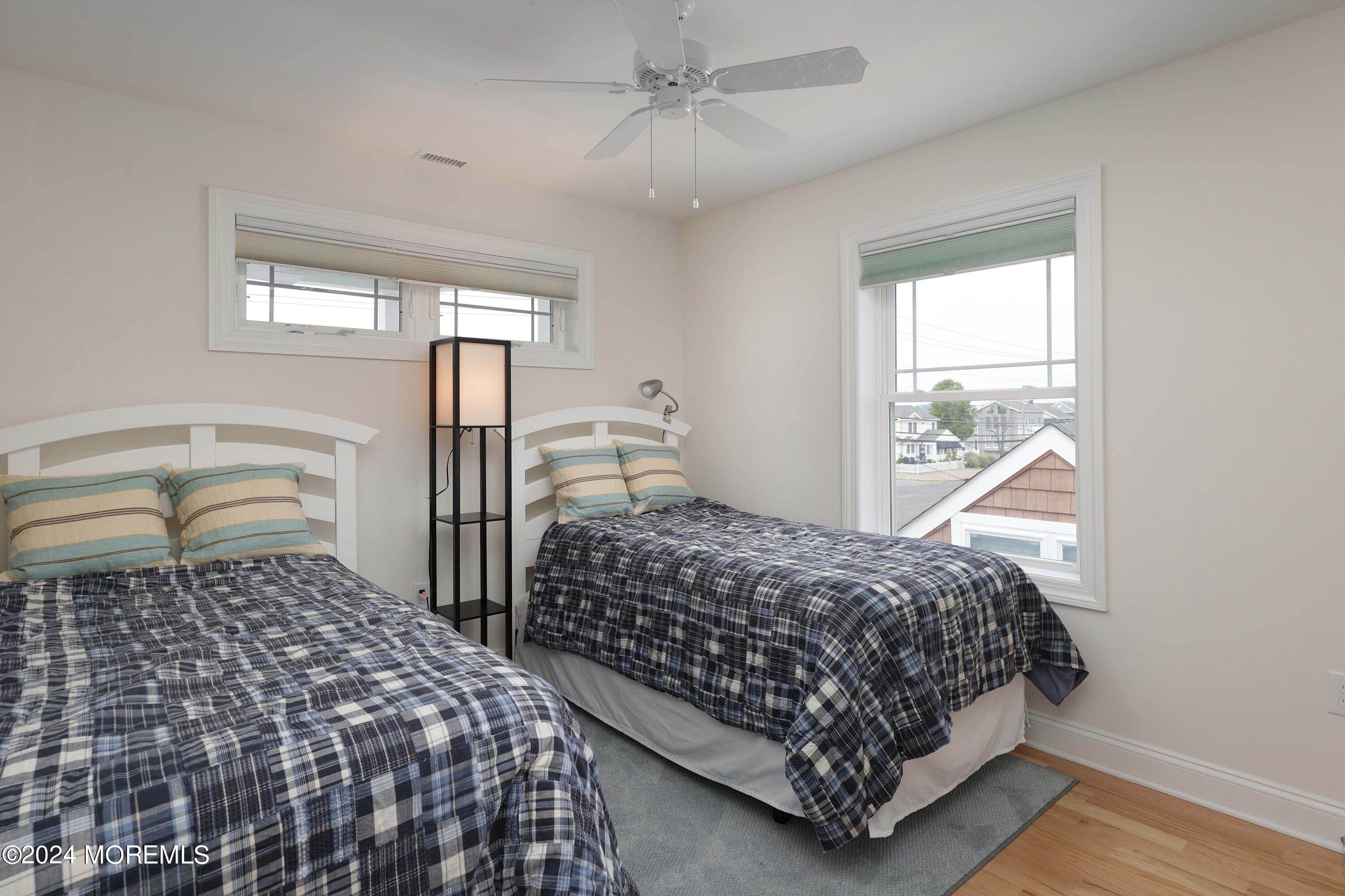 1607 Baltimore Avenue Lavallette, NJ 08735 - Photo 16 of 28 a bedroom with two beds and a window