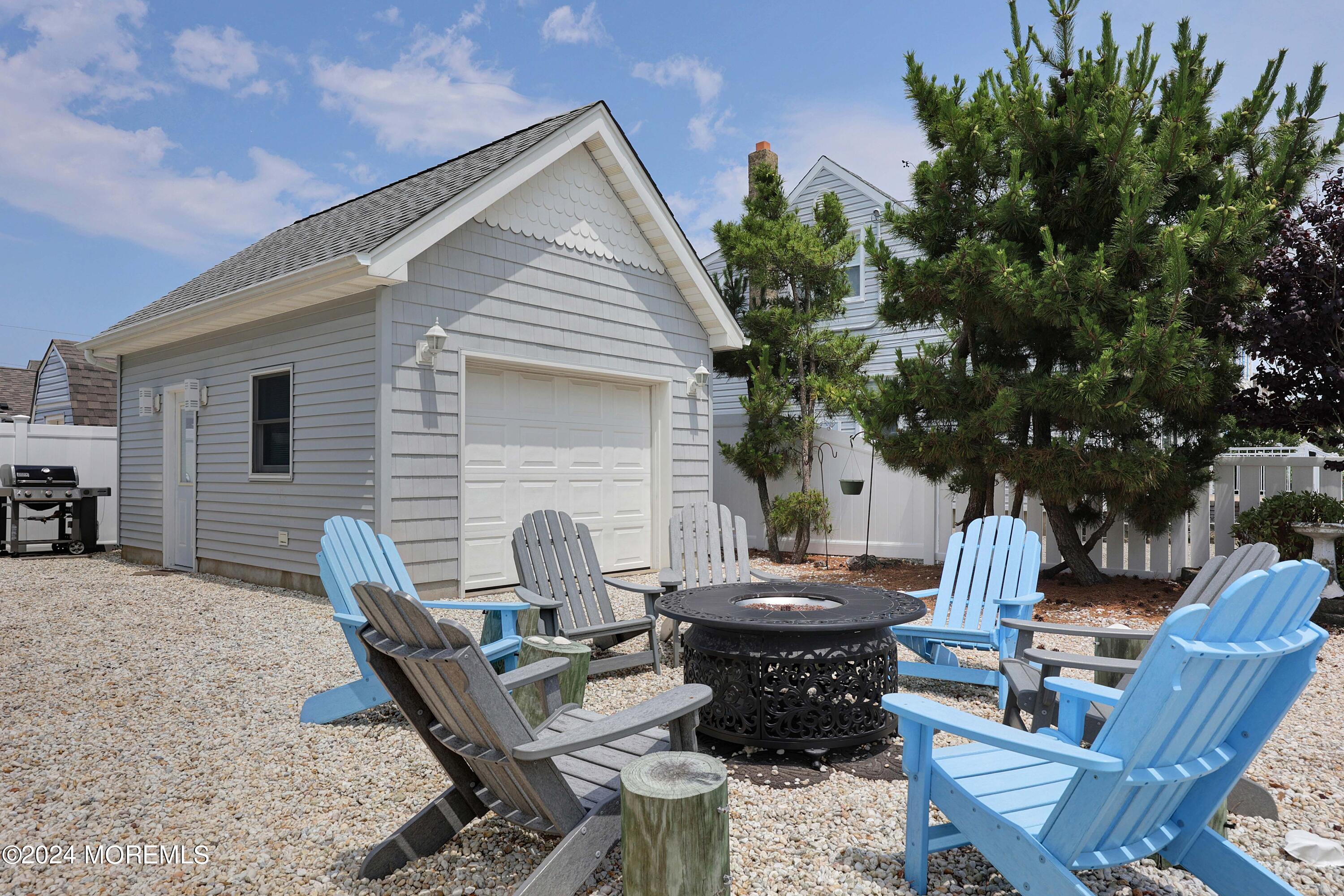 1607 Baltimore Avenue Lavallette, NJ 08735 - Photo 4 of 28 a view of backyard of house with seating space