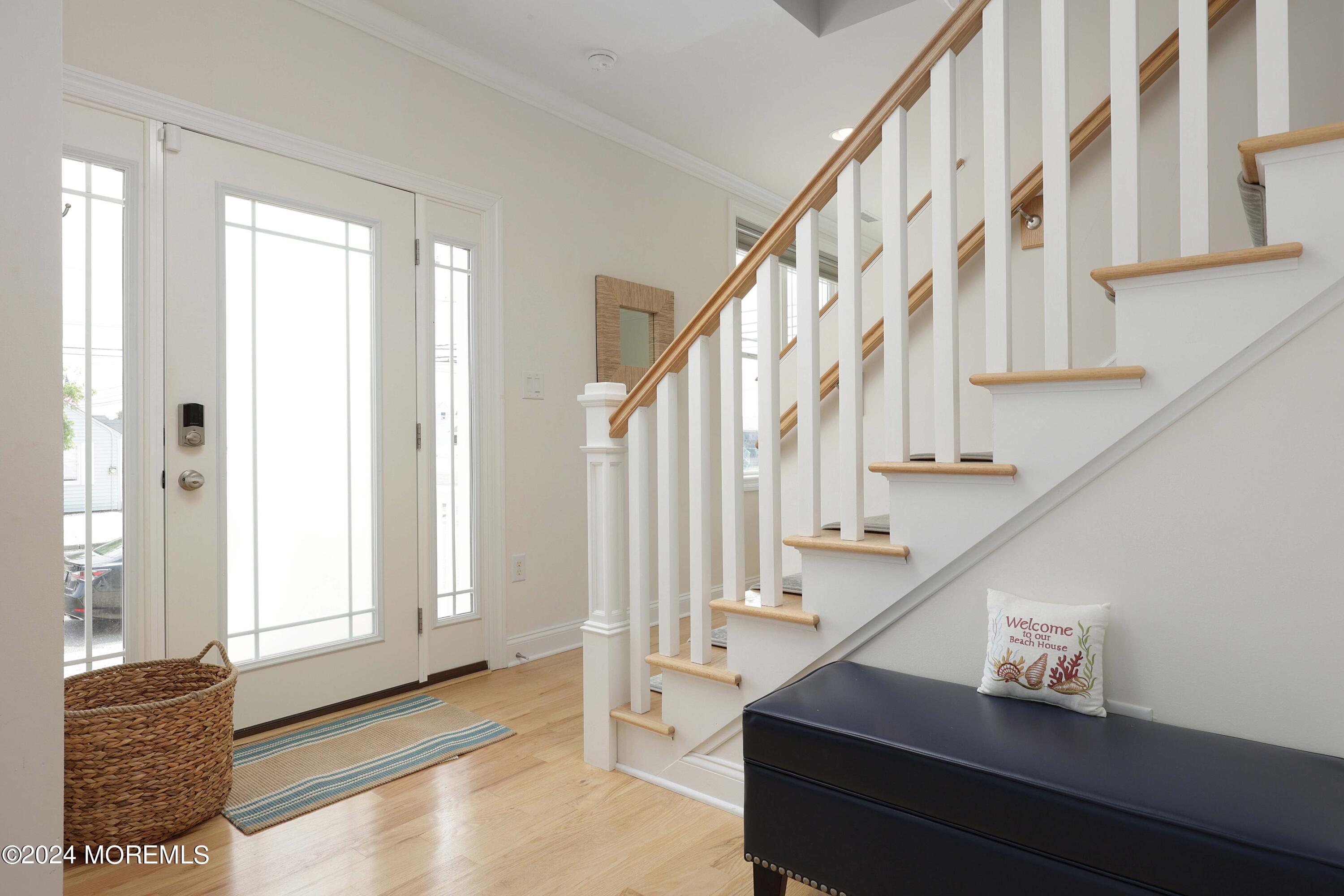 1607 Baltimore Avenue Lavallette, NJ 08735 - Photo 7 of 28 a view of entryway and hall with wooden floor