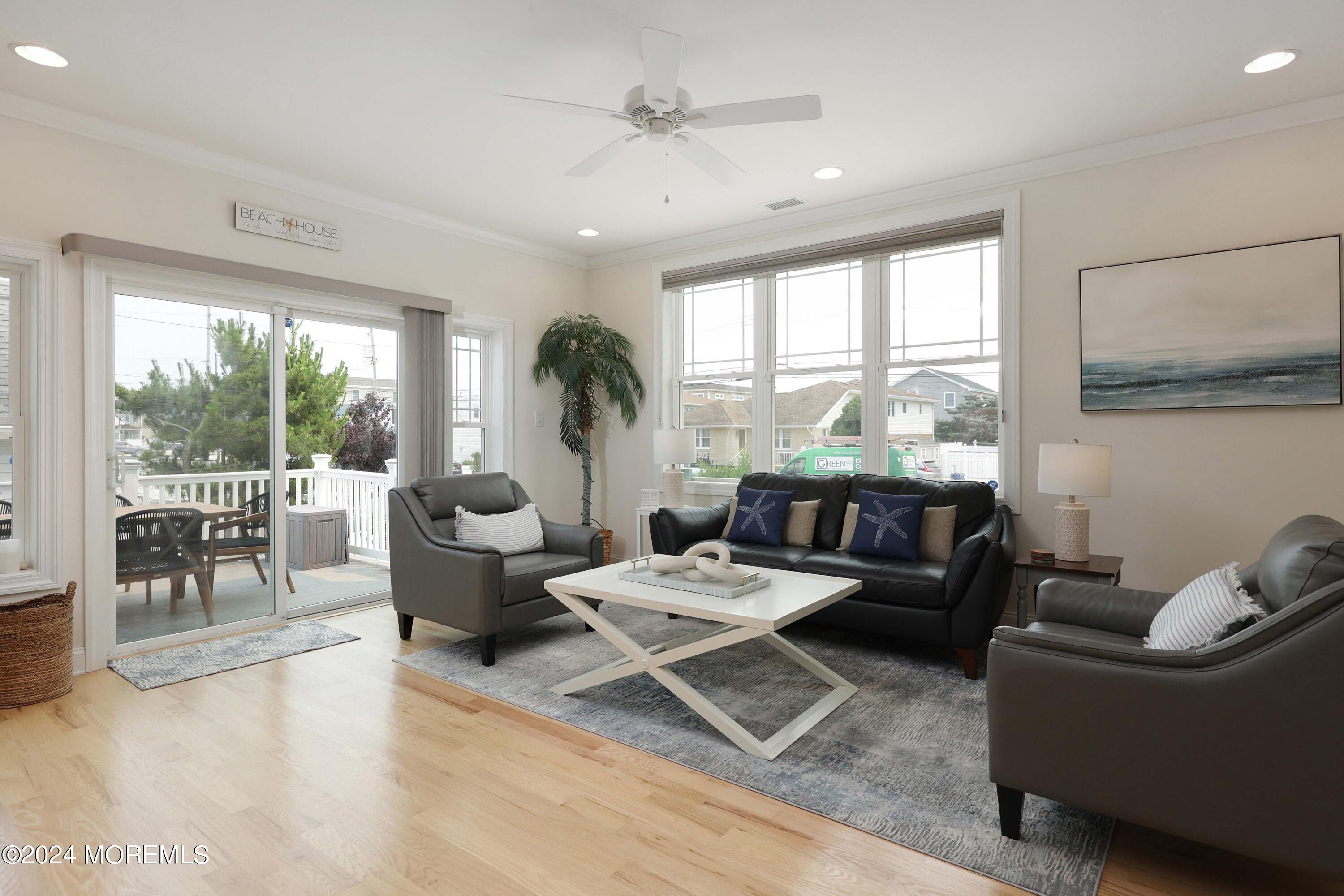 1607 Baltimore Avenue Lavallette, NJ 08735 - Photo 8 of 28 a living room with furniture and a large window