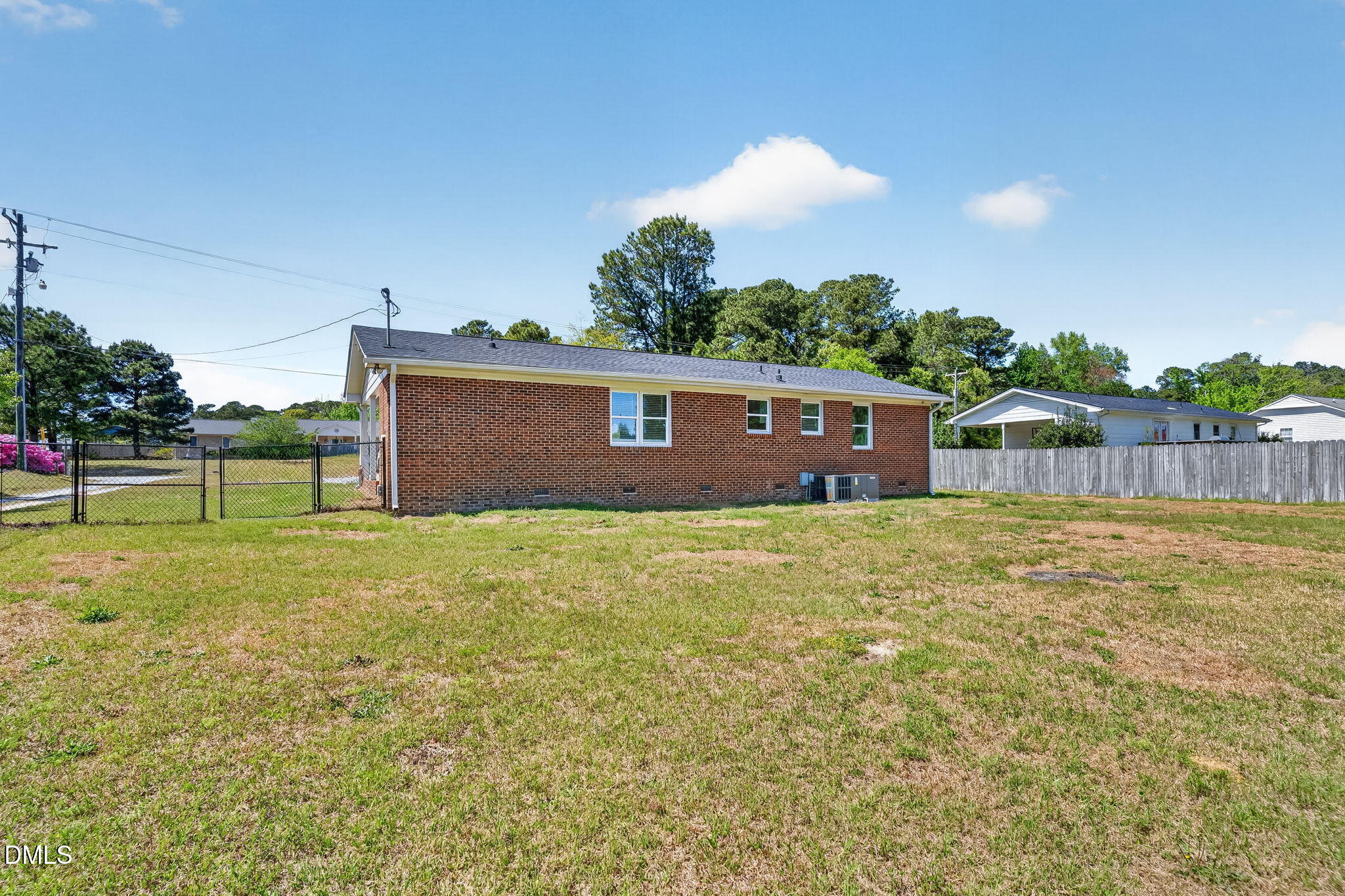 6086 Red Hill Church Road Coats, NC 27521 - Photo 28 of 44 a view of a house with a backyard