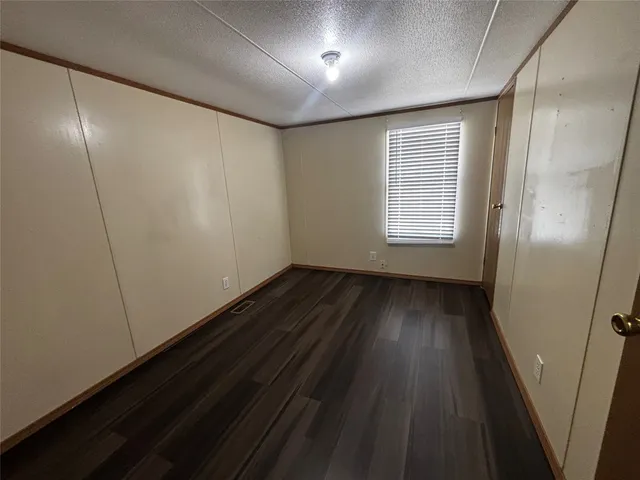 a view of hallway with wooden floor
