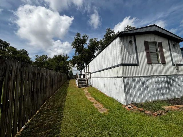 a swimming pool with wooden fence