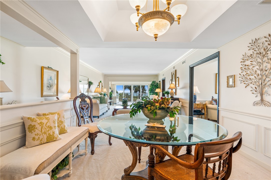 650 Beach Road, Unit 245 Vero Beach, FL 32963 - Photo 11 of 32 a view of a dining room with furniture and wooden floor