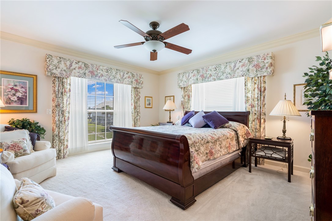 650 Beach Road, Unit 245 Vero Beach, FL 32963 - Photo 13 of 32 a spacious bedroom with a bed and a couch