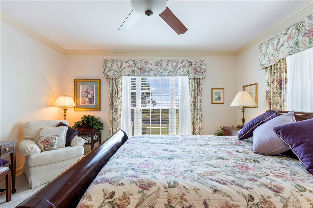 650 Beach Road, Unit 245 Vero Beach, FL 32963 - Photo 14 of 32 a bedroom with a large bed and a couch