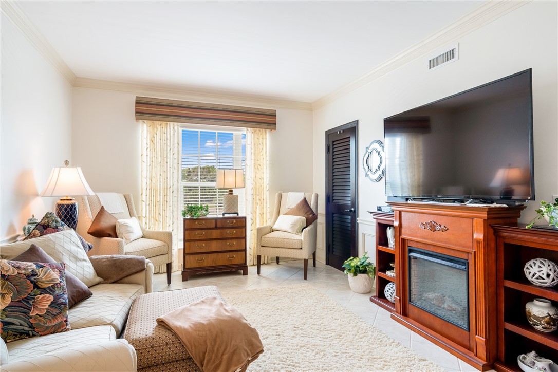 650 Beach Road, Unit 245 Vero Beach, FL 32963 - Photo 16 of 32 a living room with furniture and a flat screen tv