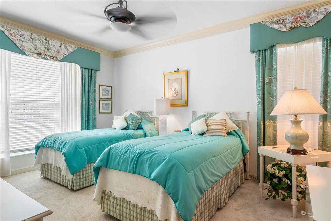 650 Beach Road, Unit 245 Vero Beach, FL 32963 - Photo 21 of 32 a bedroom with two beds and a window