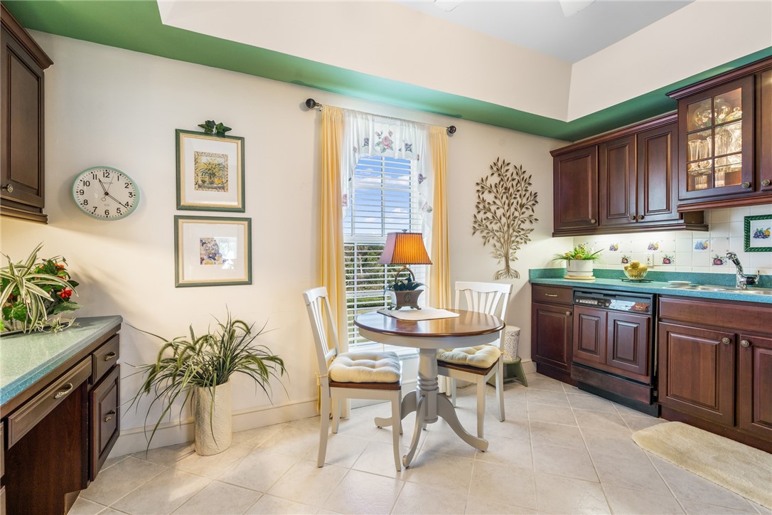 650 Beach Road, Unit 245 Vero Beach, FL 32963 - Photo 22 of 32 a kitchen with a table and chairs in it