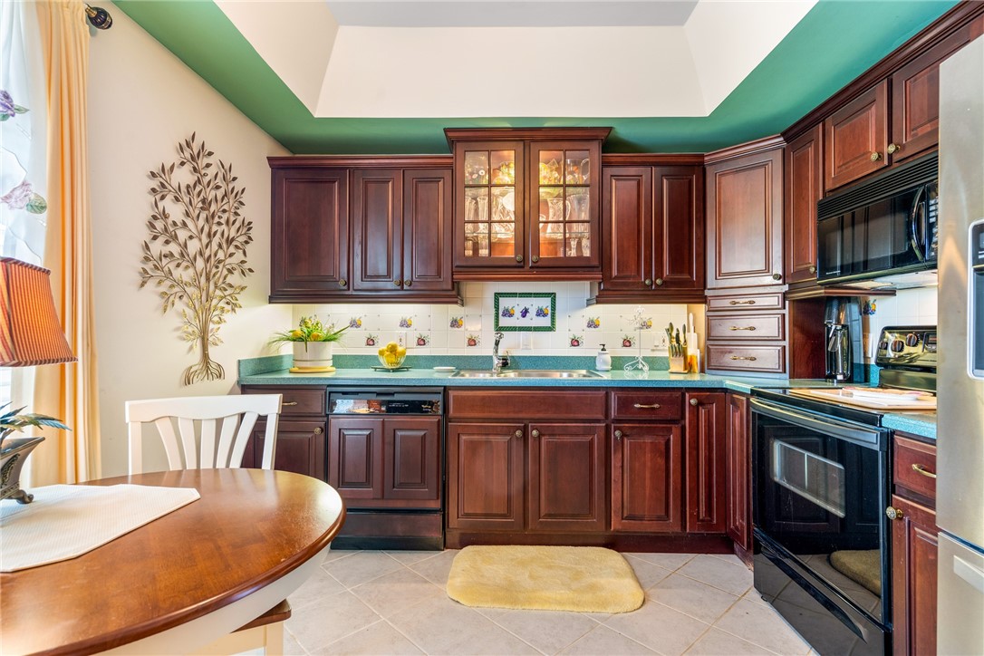 650 Beach Road, Unit 245 Vero Beach, FL 32963 - Photo 27 of 32 a kitchen with a sink cabinets and window