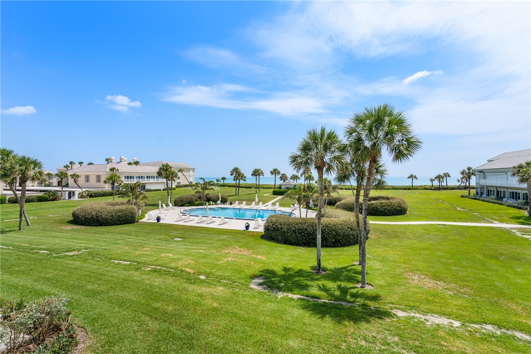 650 Beach Road, Unit 245 Vero Beach, FL 32963 - Photo 29 of 32 a view of a swimming pool and a yard