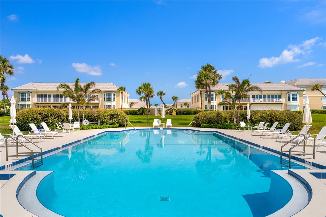 650 Beach Road, Unit 245 Vero Beach, FL 32963 - Photo 30 of 32 a view of a swimming pool with outdoor seating