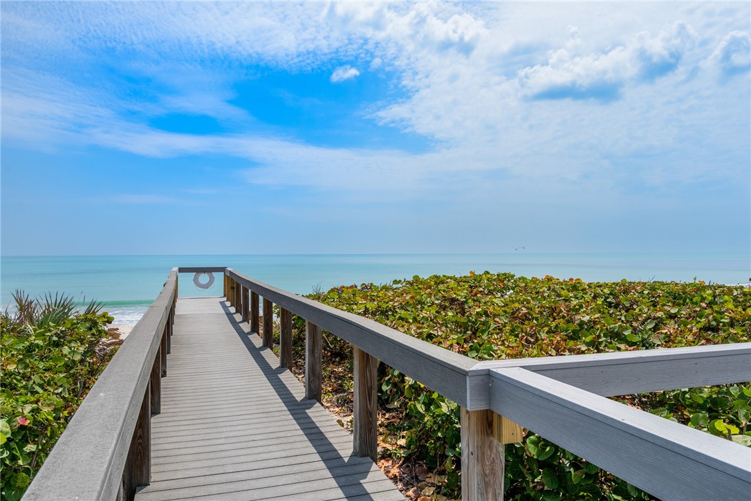 650 Beach Road, Unit 245 Vero Beach, FL 32963 - Photo 32 of 32 a view of balcony with wooden floor and fence