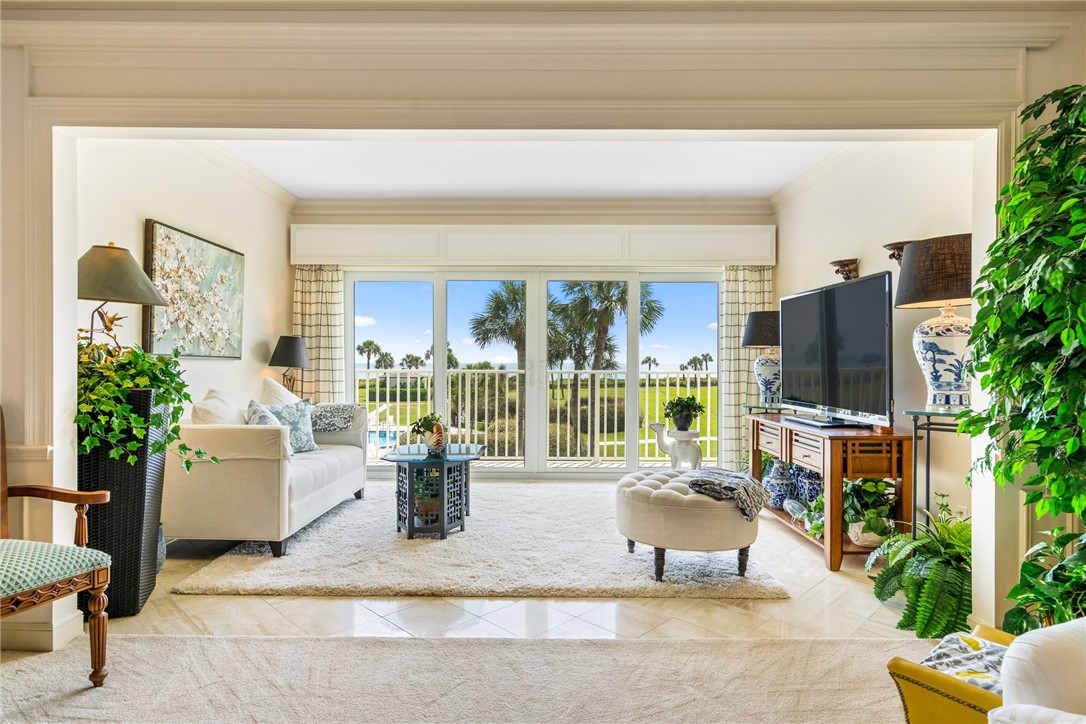 650 Beach Road, Unit 245 Vero Beach, FL 32963 - Photo 4 of 32 a living room with furniture and a flat screen tv