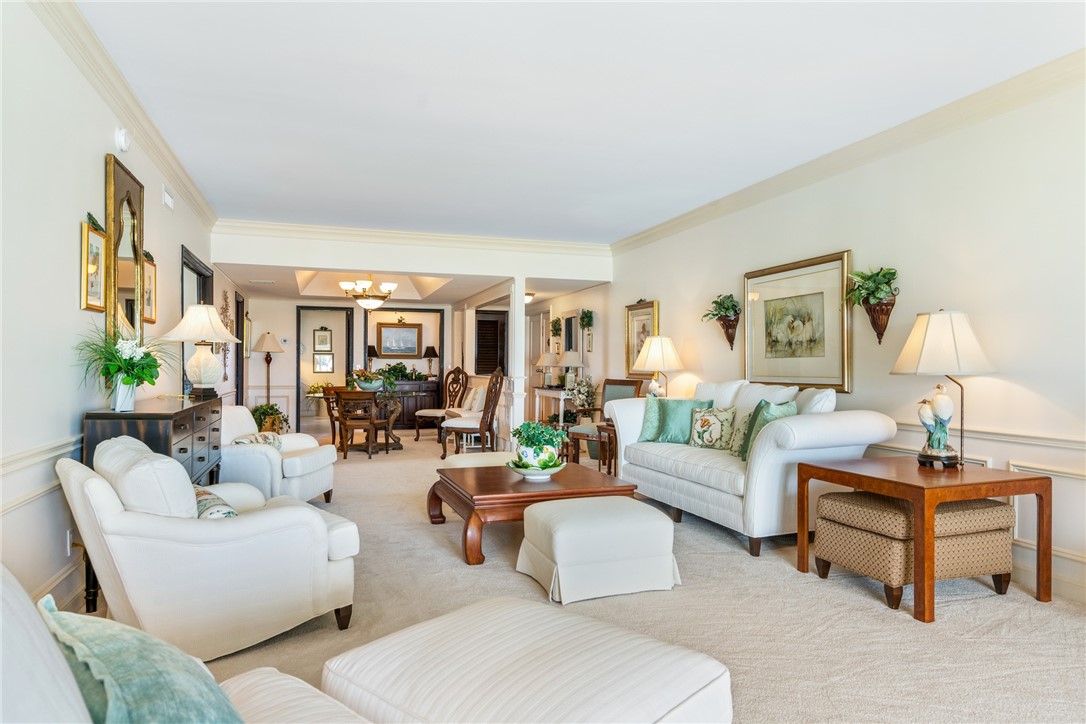 650 Beach Road, Unit 245 Vero Beach, FL 32963 - Photo 7 of 32 a living room with furniture and a lamp