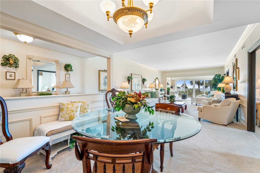 650 Beach Road, Unit 245 Vero Beach, FL 32963 - Photo 10 of 32 a dining room with furniture and a potted plant