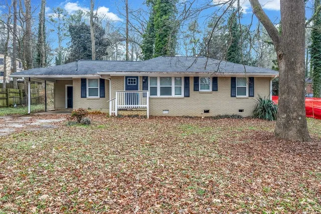 front view of a house with a yard