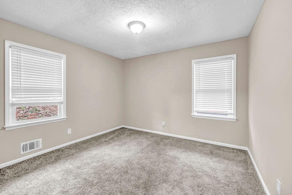 245 Bromack Drive Southeast Atlanta, GA 30315 - Photo 14 of 16 a view of an empty room with a window