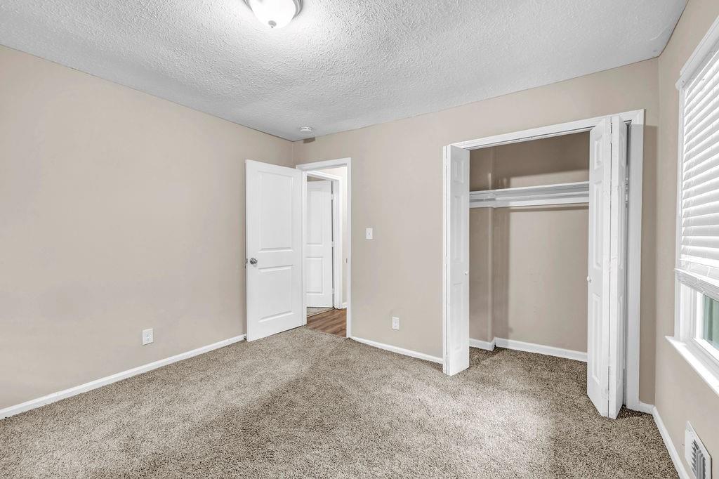 245 Bromack Drive Southeast Atlanta, GA 30315 - Photo 15 of 16 a view of an empty room with a window