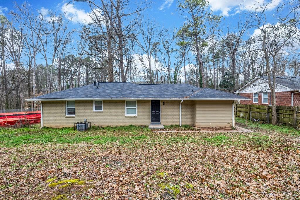 245 Bromack Drive Southeast Atlanta, GA 30315 - Photo 16 of 16 a front view of a house with a yard