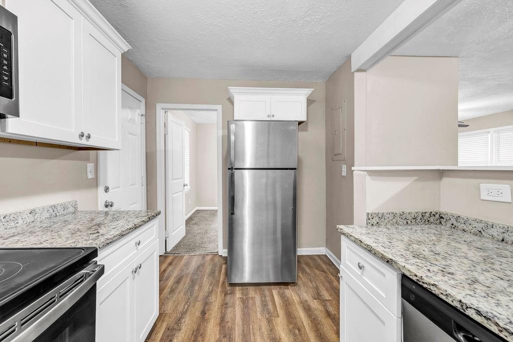 245 Bromack Drive Southeast Atlanta, GA 30315 - Photo 5 of 16 a kitchen with a refrigerator and countertop