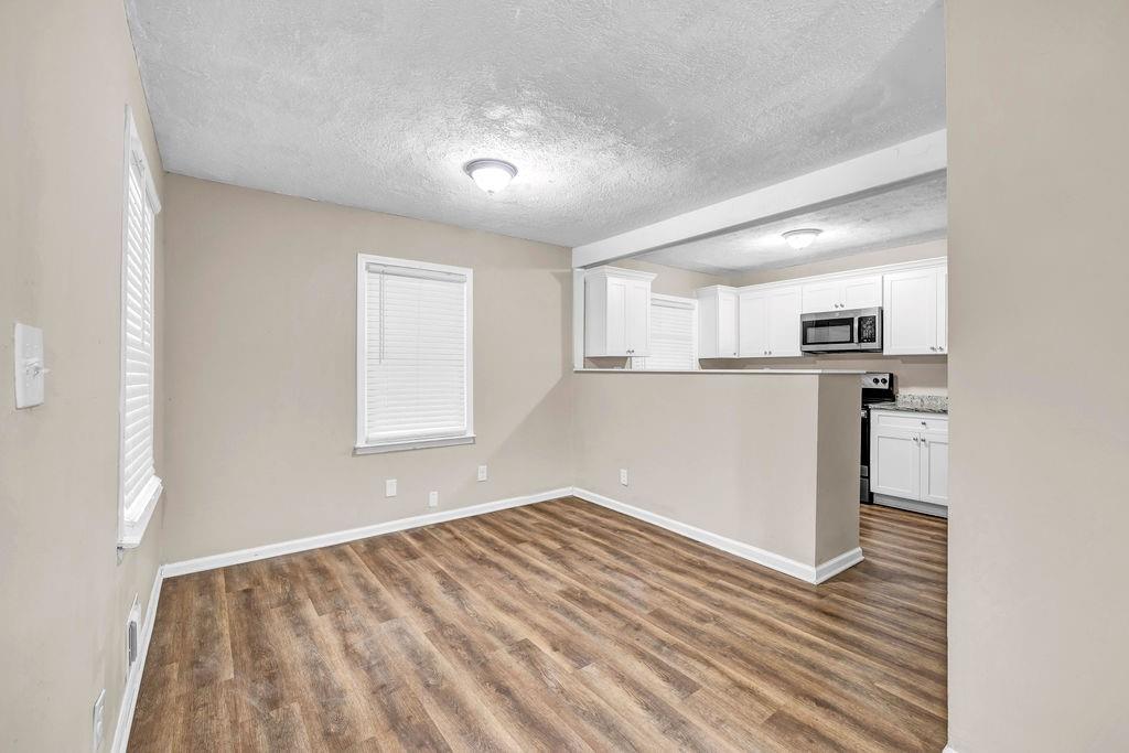 245 Bromack Drive Southeast Atlanta, GA 30315 - Photo 6 of 16 a view of kitchen with wooden floor