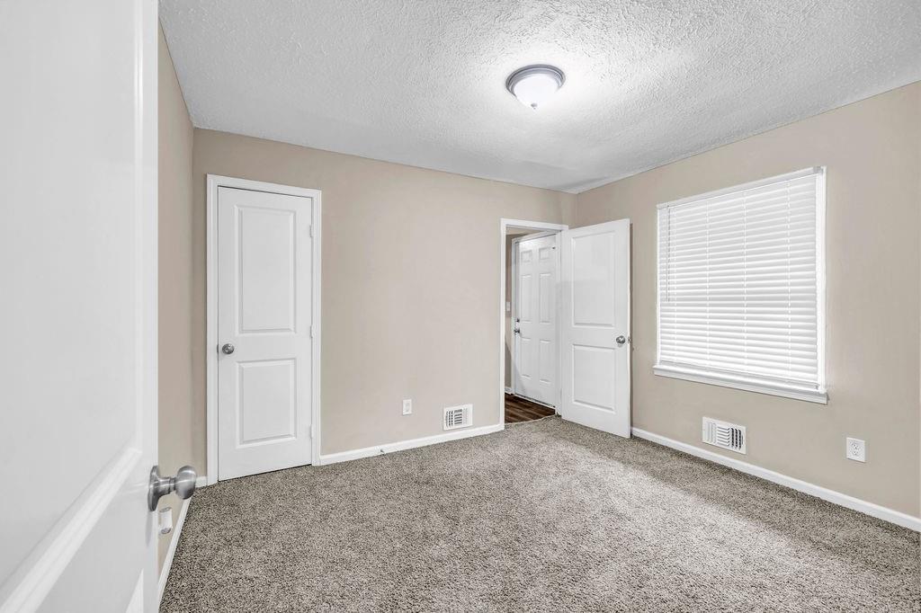 245 Bromack Drive Southeast Atlanta, GA 30315 - Photo 10 of 16 a view of an empty room with a window