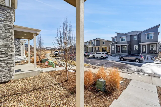 a view of a patio with swimming pool and sitting area